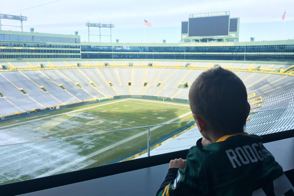 Boy overlooking Lambeau Field.