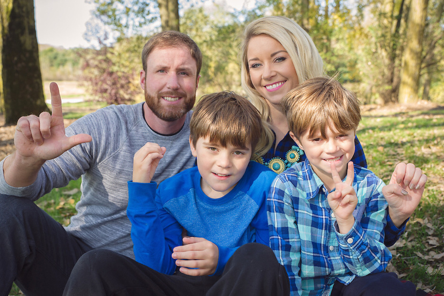 Enna Doyle and her family spelling "LOVE" in sign language.