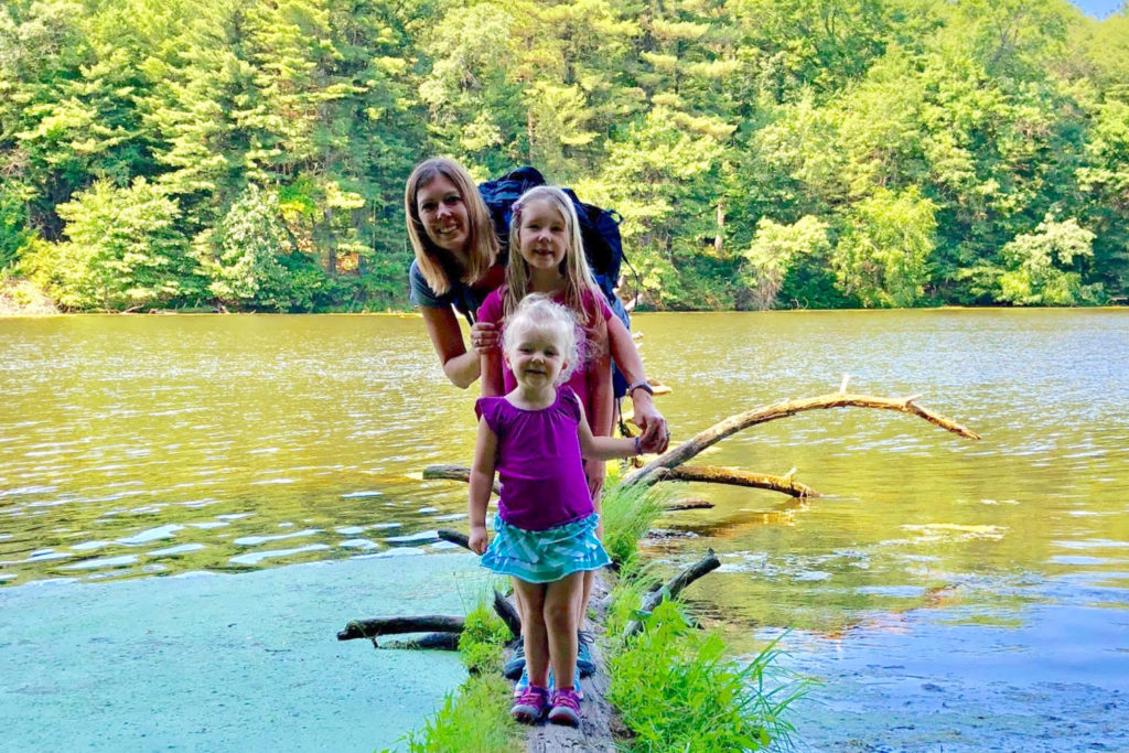 Jaime Rohr and her daughters at a lake.