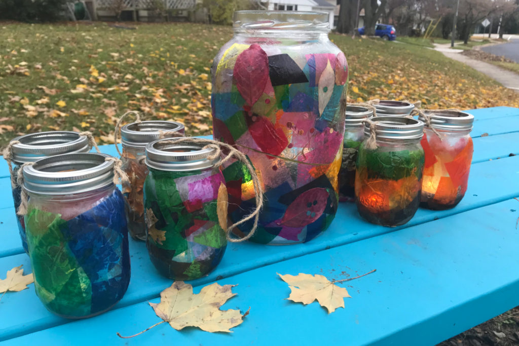 Homemade lanterns on a picnic table.