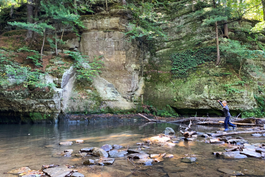 A boy explores Pewits Nest, a state natural area in Baraboo, Wisconsin.