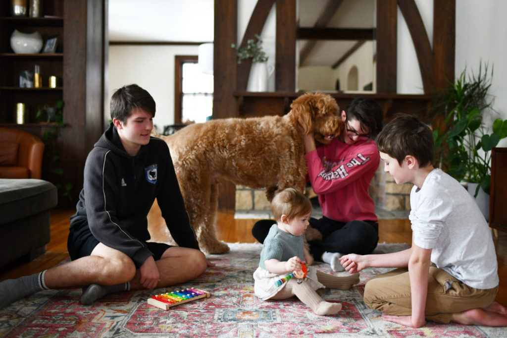 Nikki Hansens kids and dog play in their Madison, Wisconsin, home.