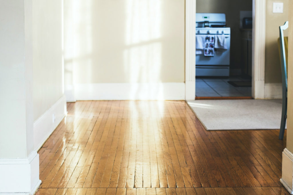 A room with wood floors.