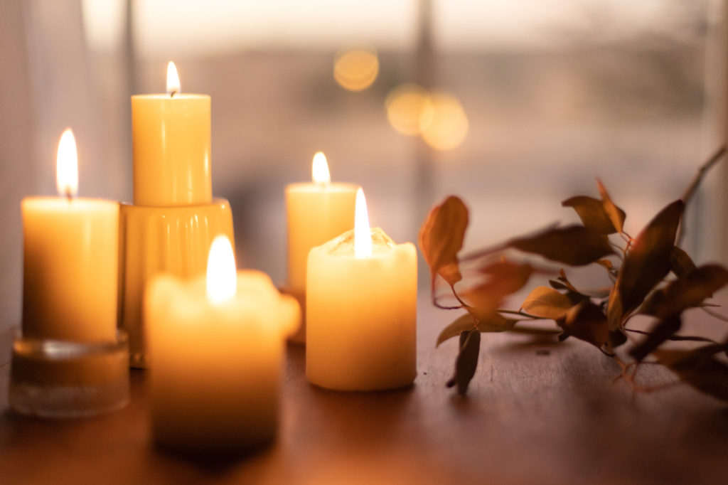 Candles on a wood table.