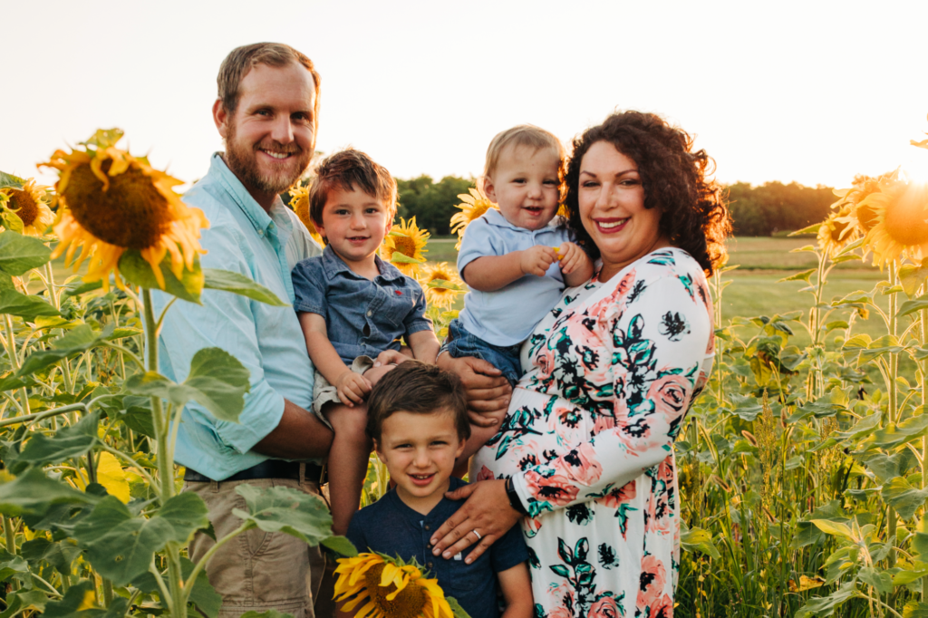 The Clarke family in a sunflower field.