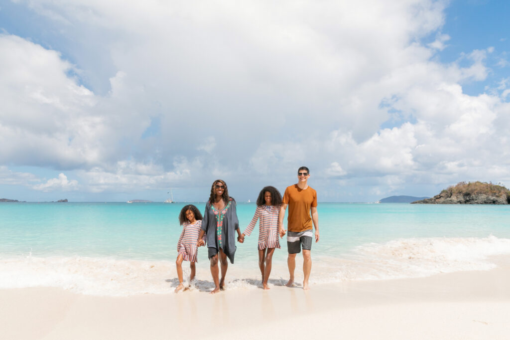 The Laufenberg family walks on the beach in the U.S. Virgin Islands.