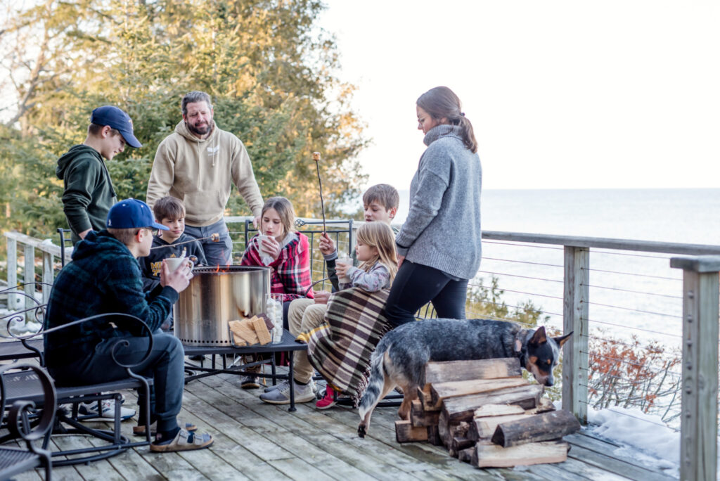 The Wolbert family of eight roasts smores on a deck in Door County, Wisconsin.