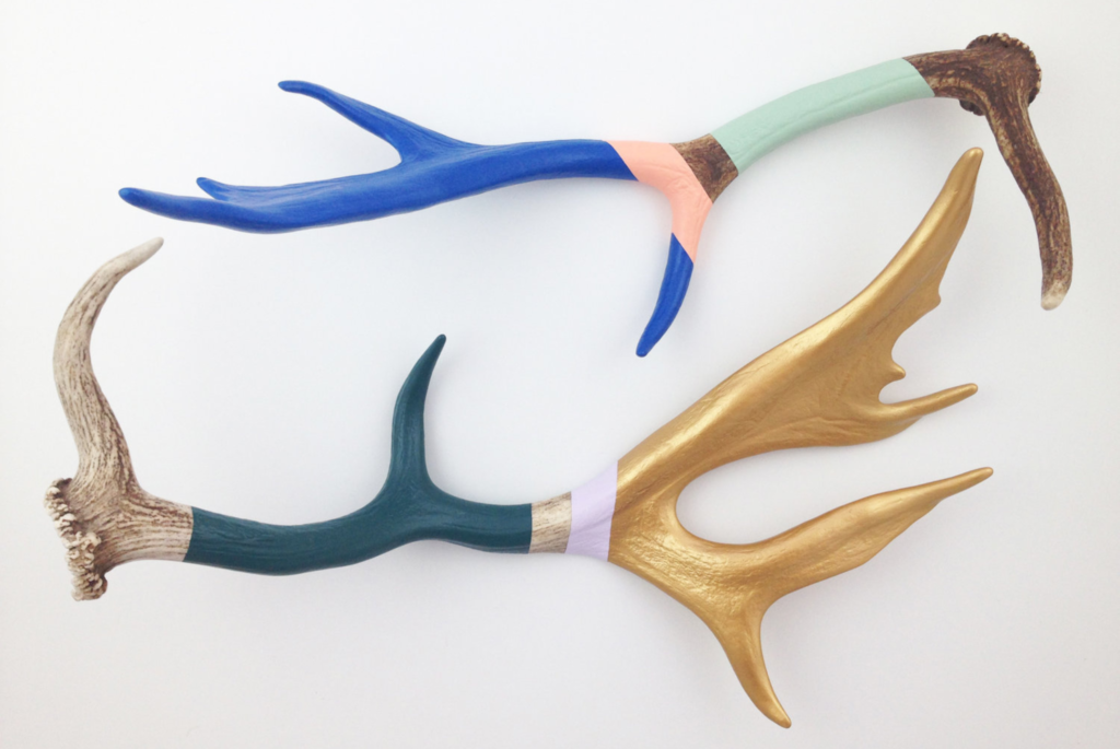 Two colorful painted antlers by Milwaukee artist Cassandra Smith.
