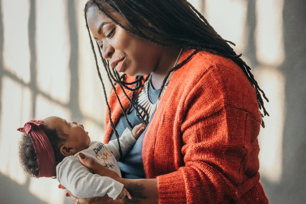 Symphony Zawadi holds her baby.