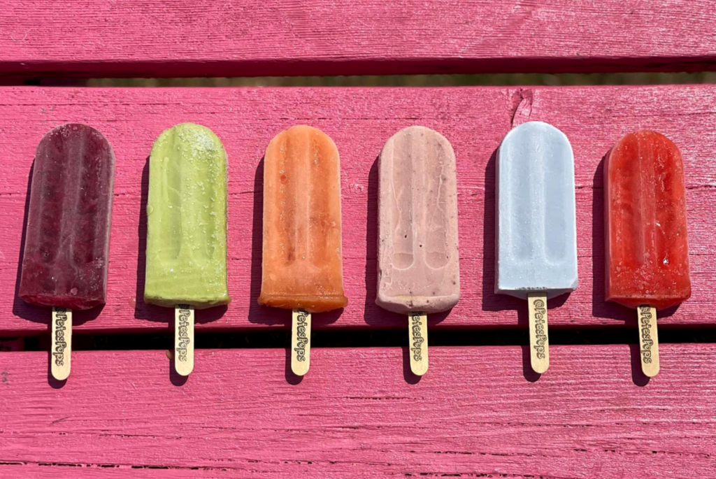Six popsicles by Pete's Pops in Milwaukee lined up on a table.