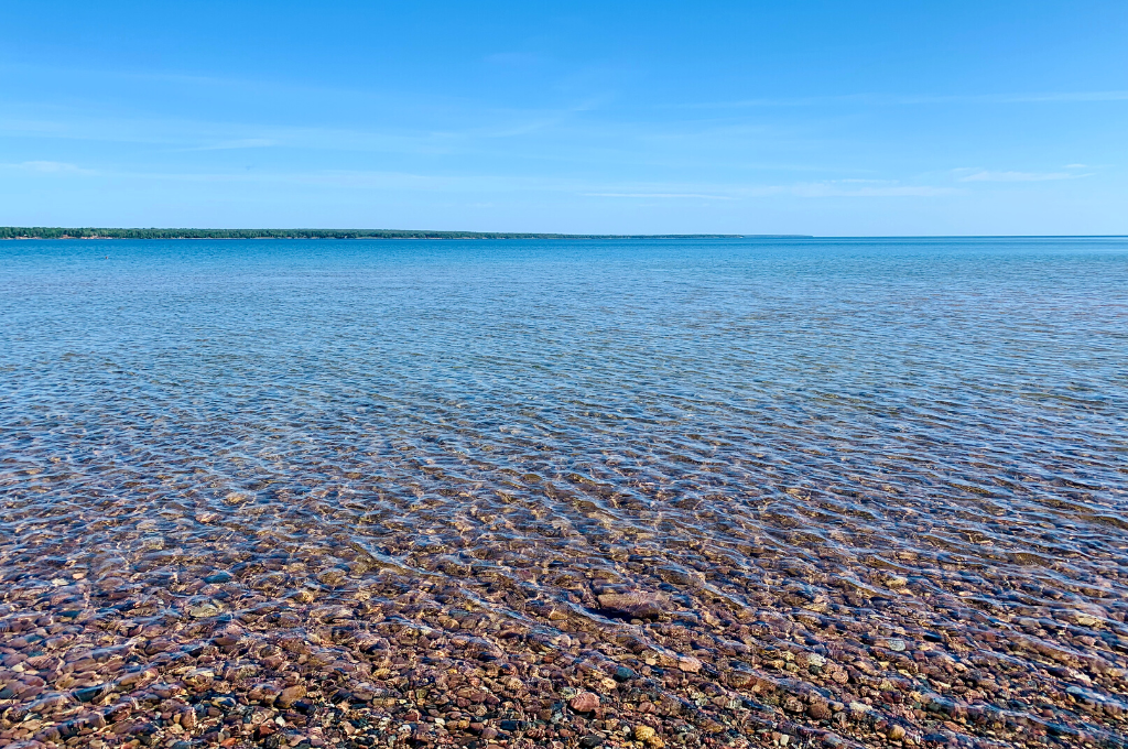 Clear Lake Superior water on the rocky shoreline of Madeline Island.
