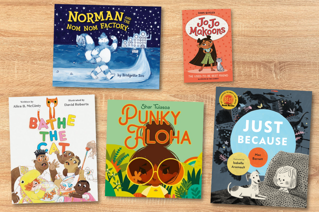 Five children's books displayed on a wood floor.